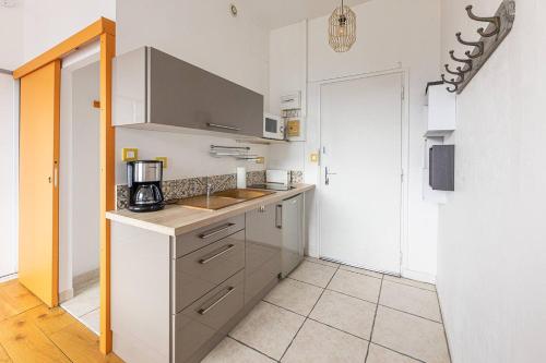 a kitchen with a sink and a counter top at Studio 181 Albion Residence Beautiful view and pool! in Aix-les-Bains