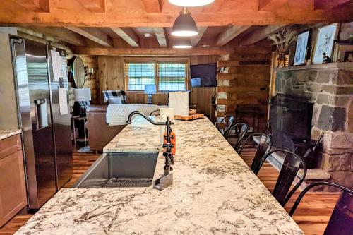 a kitchen with a large counter top in a room at Hickory Cabin by AvantStay Firepit Hot Tub Game Room Great Location in Palmerton