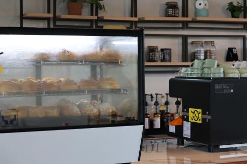 a display case in a bakery with pastries at KA MANIcamp in Angsri