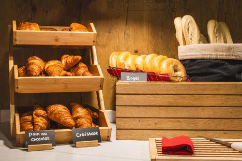 a bakery with different types of bread on display at ibis London Excel-Docklands in London