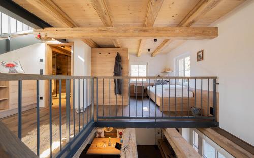 an overhead view of a room with a bed and wooden ceilings at Ferienhaus Pflugwirts in Oberkirch