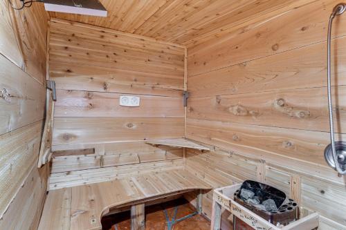 a wooden sauna with a bench in the corner at 5 Mi to Lake Secluded Pinedale Retreat with Sauna! in Pinedale