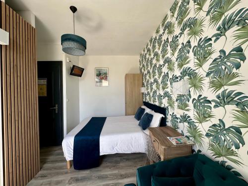 Hôtel Parc Mazon-Biarritzにあるベッド