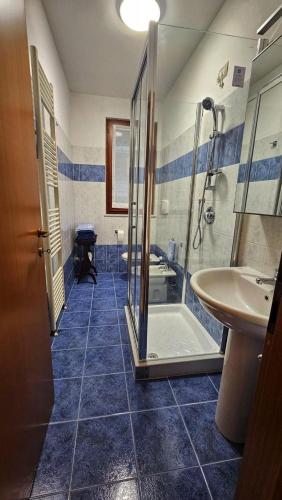 a bathroom with a shower and a sink and a tub at Alò! in Arezzo
