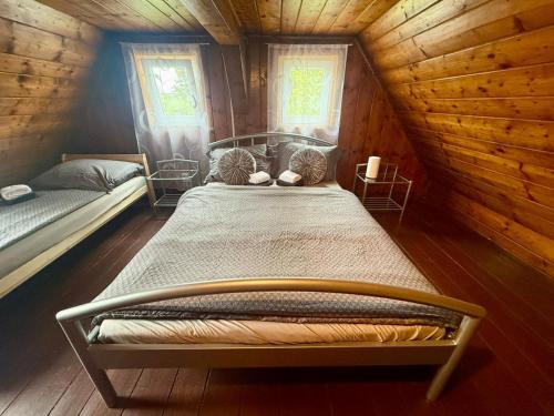 Postel nebo postele na pokoji v ubytování Domeček Drahuška