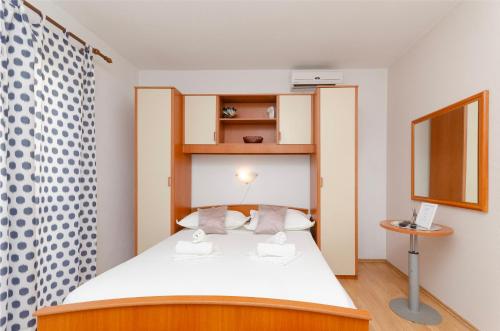 Postel nebo postele na pokoji v ubytování Apartments Katica