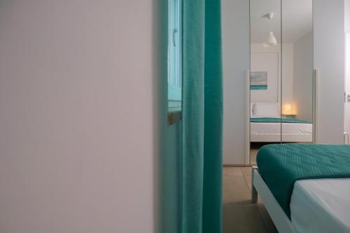 Ένα ή περισσότερα κρεβάτια σε δωμάτιο στο Casa Vacanze Palinuro-Mare