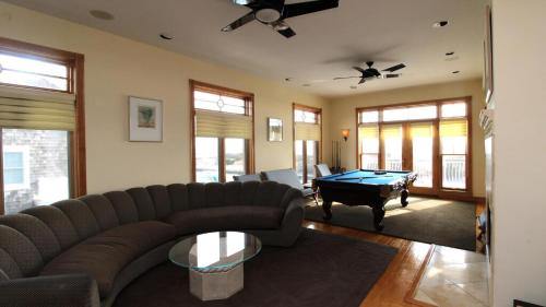 a living room with a couch and a pool table at 1217 Beach -Villa Antinori in Cape May