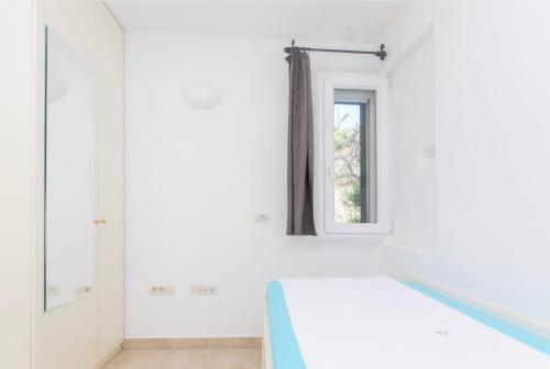 Ένα ή περισσότερα κρεβάτια σε δωμάτιο στο Villa Serena