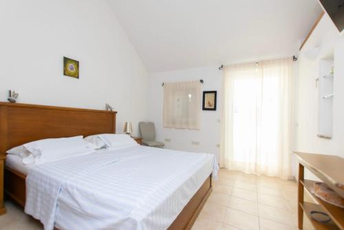 Ένα ή περισσότερα κρεβάτια σε δωμάτιο στο Villa Serena