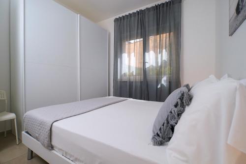 Ένα ή περισσότερα κρεβάτια σε δωμάτιο στο Casa Vacanze Palinuro-Mare