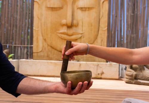 a person holding a mortar and pestle at La Masía de Formentera in Sant Francesc Xavier