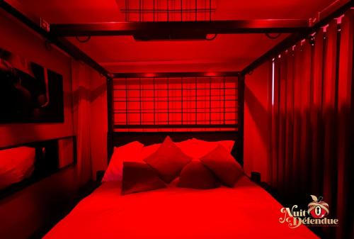 Katil atau katil-katil dalam bilik di Nuit Défendue Jacuzzi-Sauna