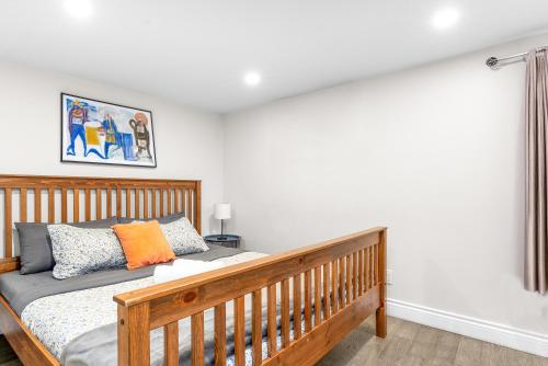 a bedroom with a wooden bed in a room at Charming 1BR Flat in Ottawa Historic Lower Town in Ottawa