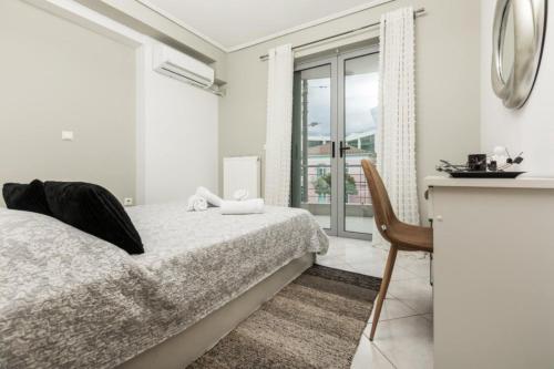 Posteľ alebo postele v izbe v ubytovaní Sparta View Apartments Anais Boutique A1