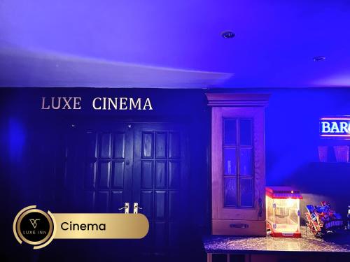 a blue room with two doors and a sign at Luxury 4 Bed Room House, Heathrow in Colnbrook