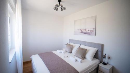 Postel nebo postele na pokoji v ubytování Apartman Luce