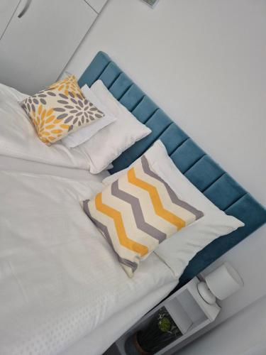 Ένα ή περισσότερα κρεβάτια σε δωμάτιο στο Apartament Mirela
