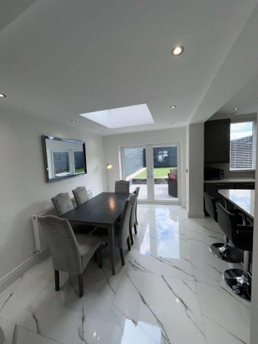 a dining room with a table and chairs at The Earls in Newry