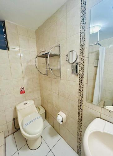 a bathroom with a toilet and a sink at Casona Plaza Hotel Colonial in Arequipa