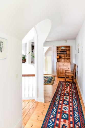 a living room with a rug on the floor at Copenhagen Denmark by the Sea Villa Solrd Strand in Solrød Strand