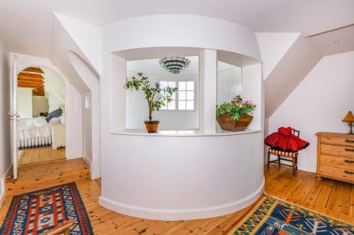 a living room with white walls and wooden floors at Copenhagen Denmark by the Sea Villa Solrd Strand in Solrød Strand