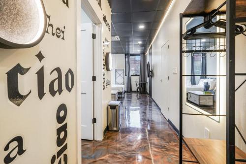 a hallway of a store with a sign on the wall at New Loft 3 min to Local hospitals Sleeps 4 in Pittsburgh