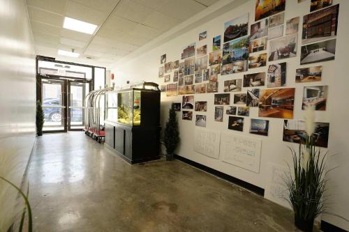 a room with a wall with pictures on it at New Loft 3 min to Local hospitals Sleeps 4 in Pittsburgh