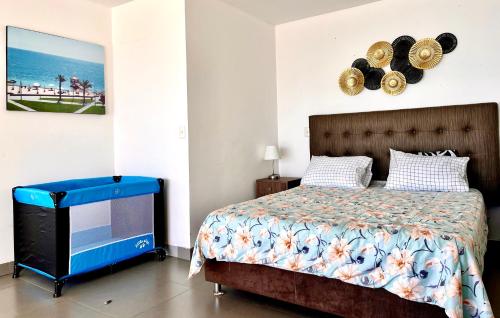 Katil atau katil-katil dalam bilik di Suite 1ra Fila Vista Bahía Paracas - Sotavento 601 T3