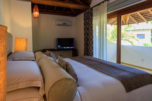 Televisyen dan/atau pusat hiburan di Campo Bahia Hotel Villas Spa