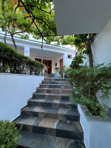 a set of stairs leading to a house at Guest house Loloçi in Gjirokastër