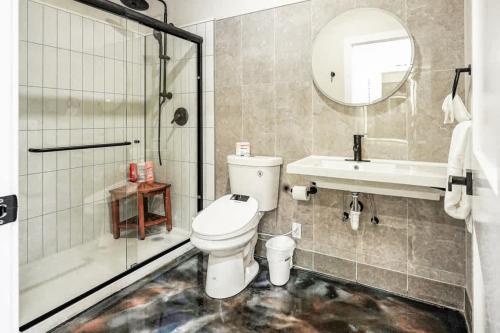 a bathroom with a toilet and a shower and a sink at New Loft 5 min Shadyside or East Liberty Sleeps 4 in Pittsburgh