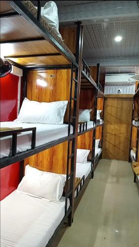 Ένα ή περισσότερα κρεβάτια σε δωμάτιο στο Lucky Dormitory