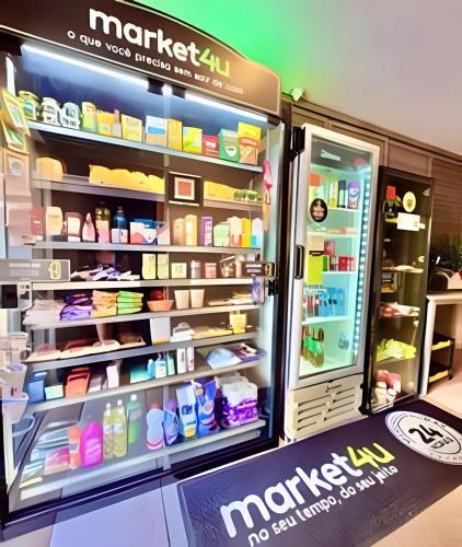 an open refrigerator filled with lots of food at Exuberante studio Bem no centro da Cidade in Curitiba