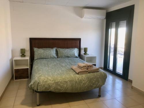 Ένα ή περισσότερα κρεβάτια σε δωμάτιο στο Casa Xafandoles