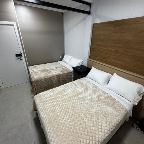 Katil atau katil-katil dalam bilik di Loft Lux SM 02 (Smart TV, Ar condicionado, Cozinha)