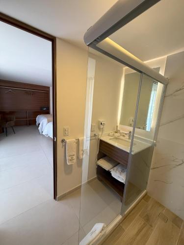 a bathroom with a sink and a mirror at Hotel Casa Kavia Vallarta in Puerto Vallarta