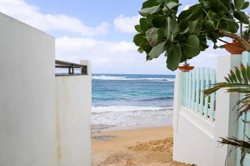 an open gate to the beach at Villa Sessions 1 - 2-Bedroom, 1-Bathroom Apartment at Shacks Beach - Beach access footsteps away in Isabela