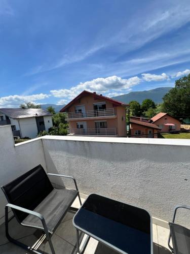 a chair sitting on the roof of a house at Apartmani Gandi in Bihać