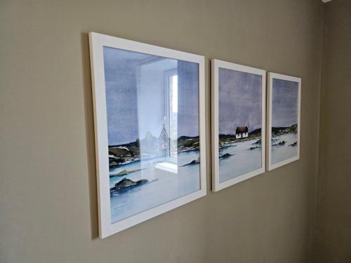 three pieces of art hanging on a wall at Central Oban 2BR Short walk to Ferries and Harbour in Oban