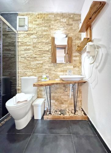 a bathroom with a toilet and a sink at Sazlı Shores in Ayvacık