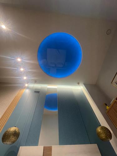 a bowling alley with a blue circle on the wall at Lounge garden sea relax in Valencia