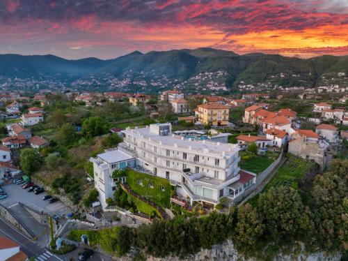 an aerial view of a building in a city at sunset at Hotel le Rocce - Agerola, Amalfi Coast in Agerola
