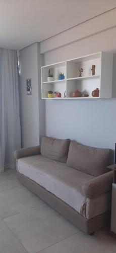 a living room with a couch in a room at Recife Infinity Pool - VIP in Recife