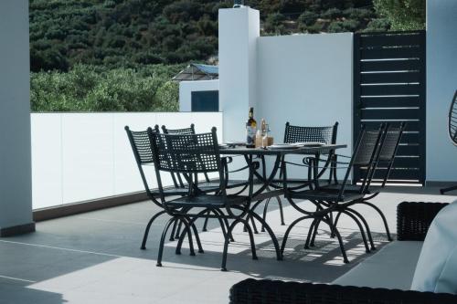 a table and chairs sitting on a patio at Modern Villa with Private Pool - Olive Grove in Ferma