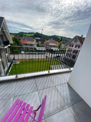 a purple chair sitting on top of a balcony at Upper Floor in Oberburg