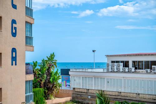 a view of the ocean from a building at Apolo XI, Calpe, Modern Holiday Apartment, Sea view, Pool, 100m to Beach! in Calpe