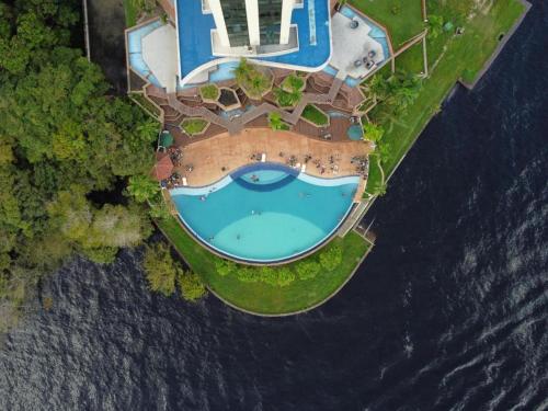 an aerial view of an island in the water at Tropical executive vista Rio in Manaus