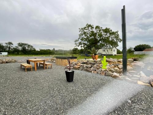 a park with benches and a table and a fire hydrant at BERRY's CHARM in Le Pêchereau