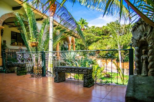 a balcony with a bench and a fence at ANANA Rancho San Rafael Pool and Lake Views in Ajijic
